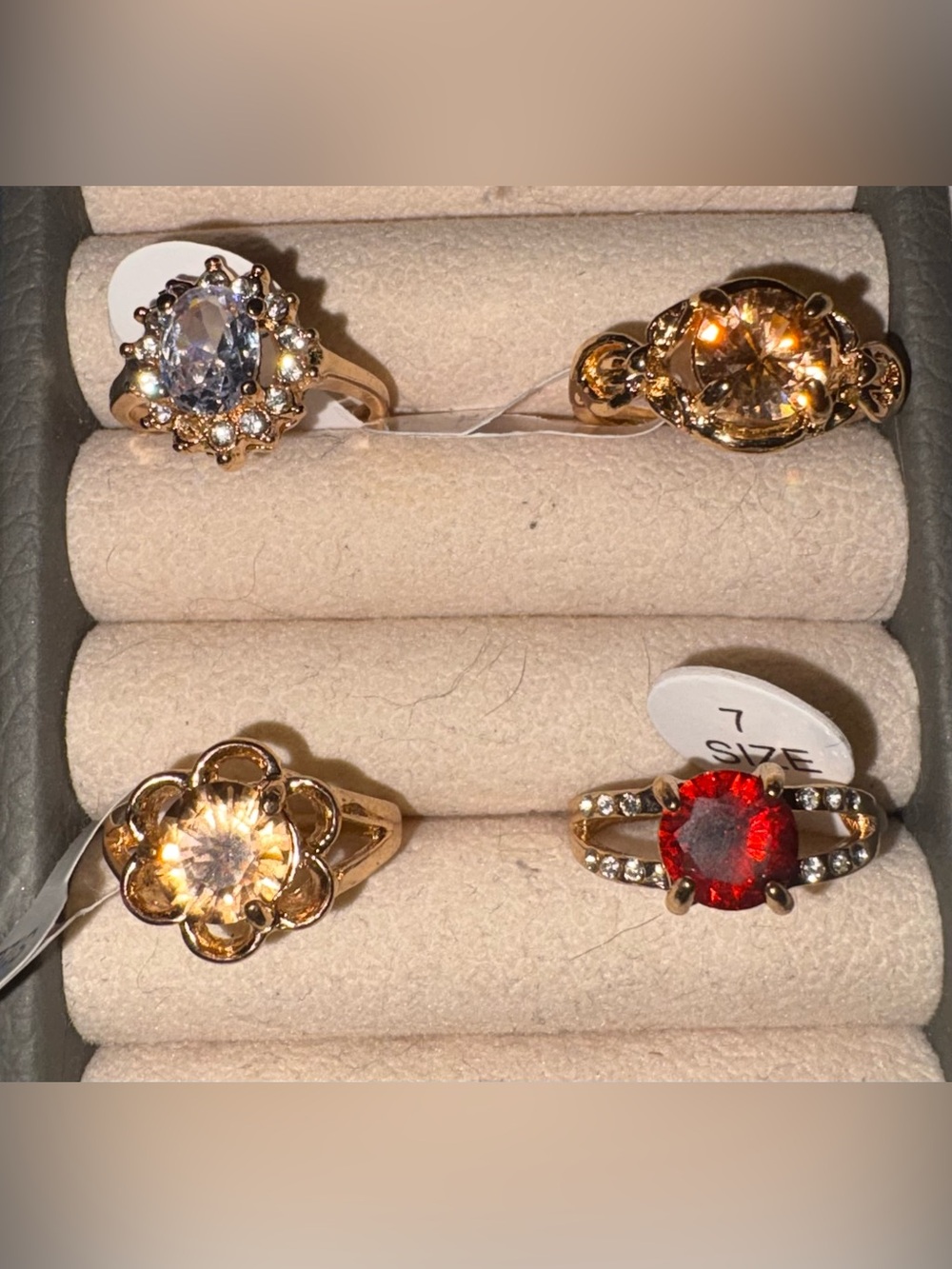 Gold tone costume rings all size 7. You get all 4